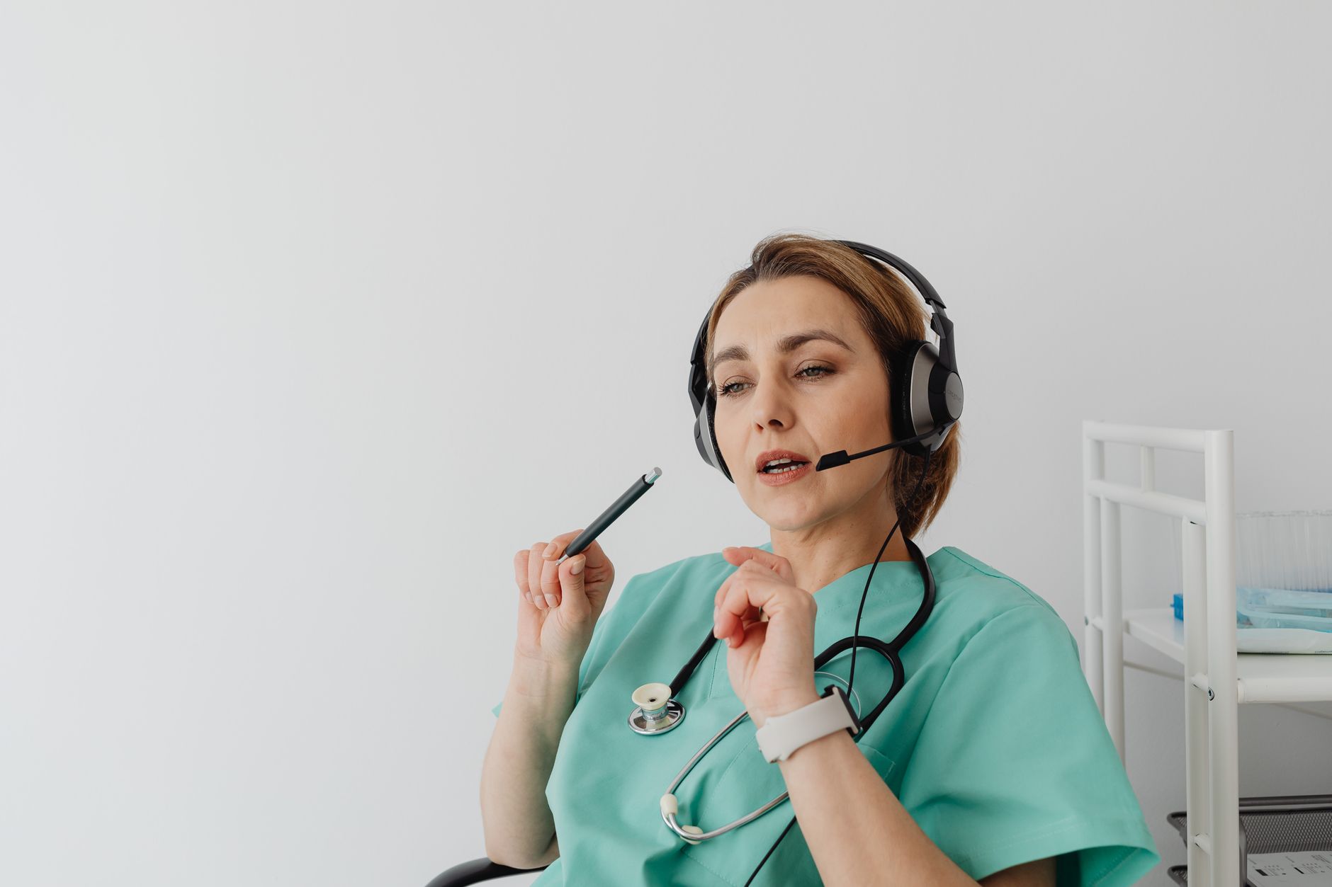 Clinic coordinator using AI automation tools to nurture international patient enquiries across time zones on a laptop screen