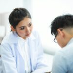 A doctor and international patient having a transparent, reassuring consultation in a modern clinic setting