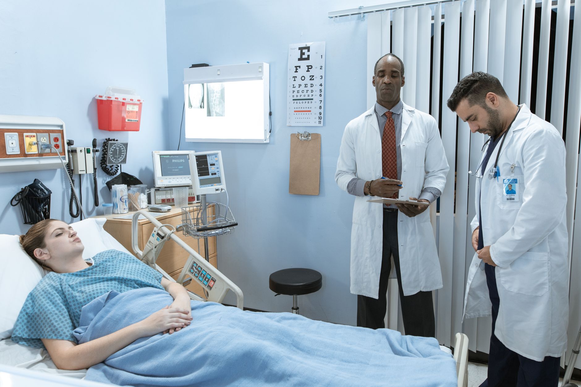 Clinic director reviewing UK patient acquisition cost metrics on a laptop dashboard