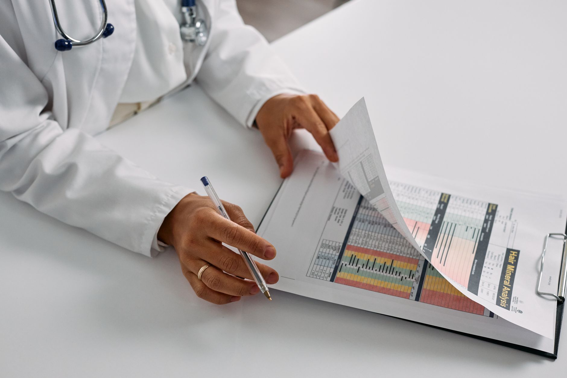 A clinic director reviewing UK patient lifetime value and acquisition cost data on a marketing dashboard