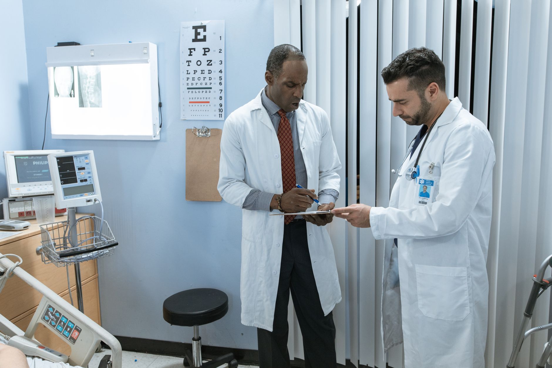 A clinic consultant reviewing treatment options with an international patient in a modern medical facility