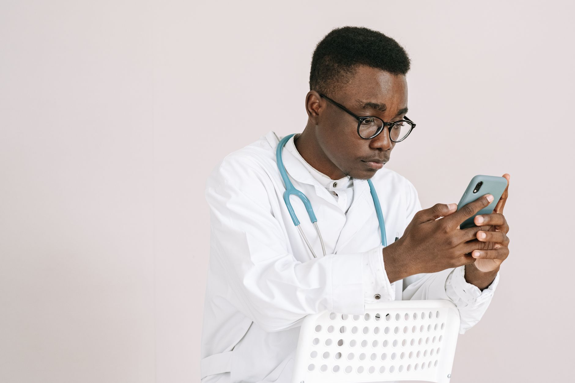 Patient receiving a WhatsApp message from a clinic's AI follow-up system on a smartphone
