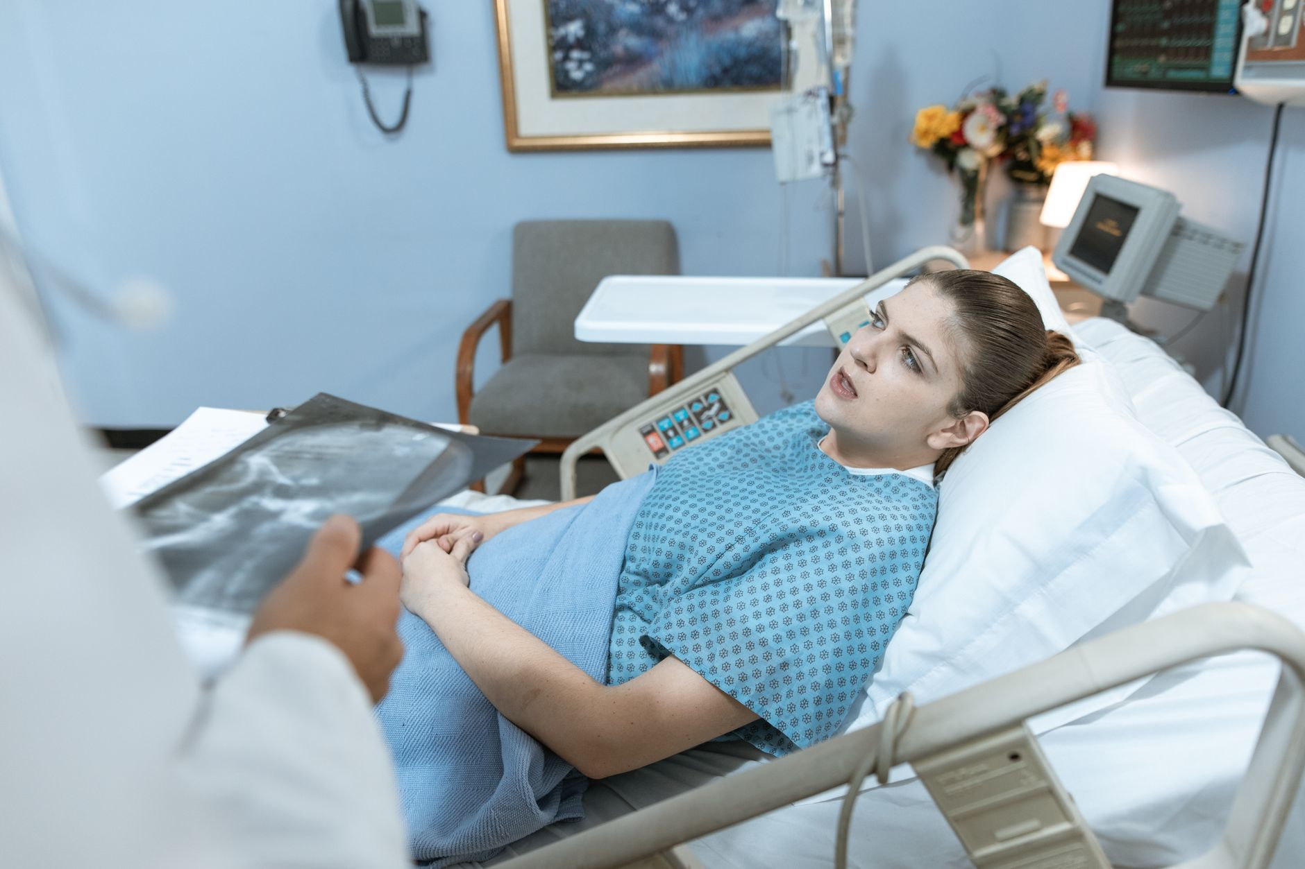 A recovering patient on a video call with their overseas clinic during post-operative aftercare at home in the UK