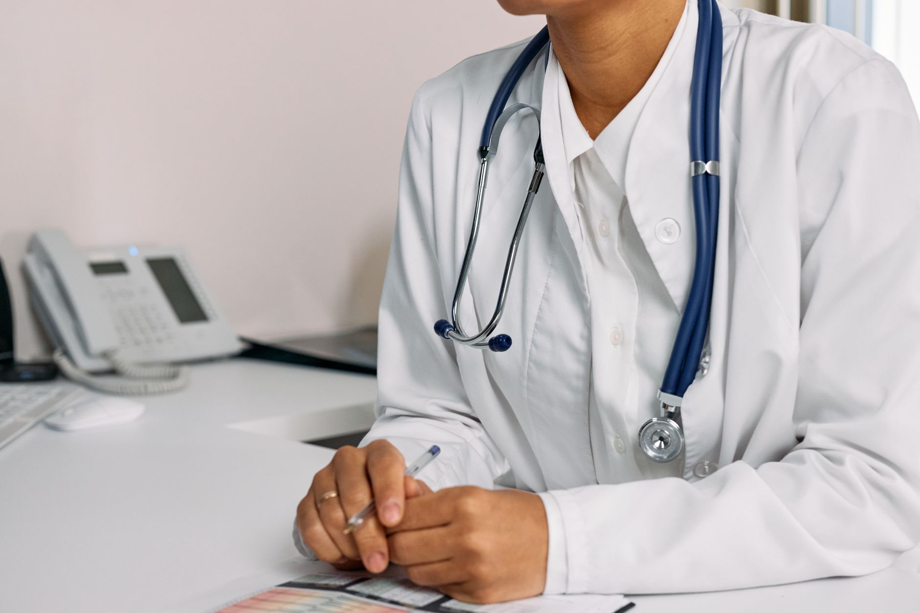 Clinic coordinator presenting a treatment package to an international patient during a consultation